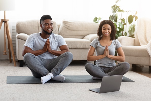 couple practicing yoga