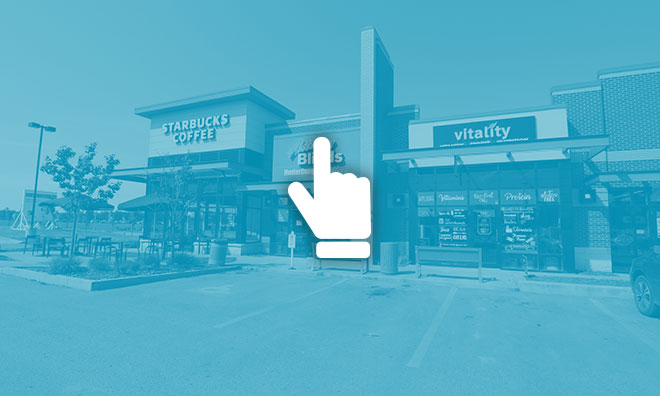 Hand icon hovering over a photo of Strathcona County businesses