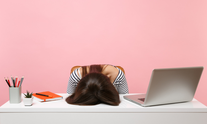 Teenager banging head on desk