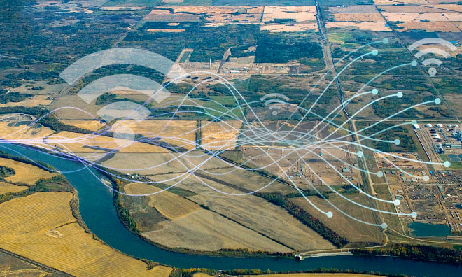 Graphic of wifi symbol and network representation super imposed over an aerial picture of north Strathcona County