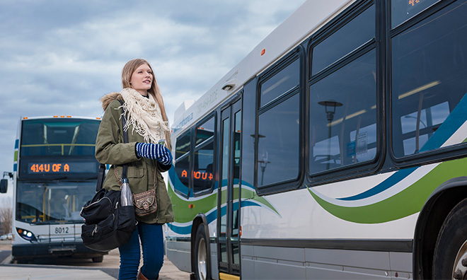 Young woman approaching the bus.