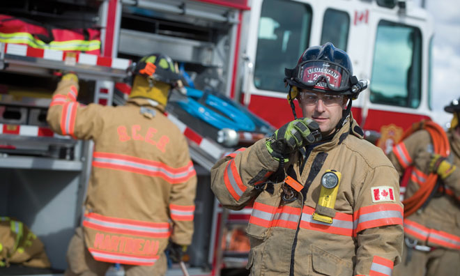 Fire fighters in front of fire truck