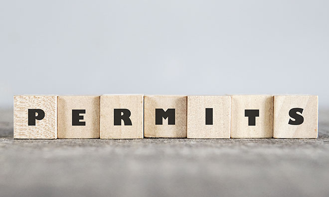 image of building blocks that spell out the word permits