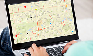 Image of a person using the CountyWorks construction map on a laptop