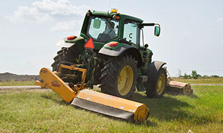 Mower working in the ditch.