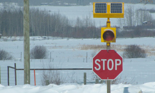 Stop sign at rural intersection.